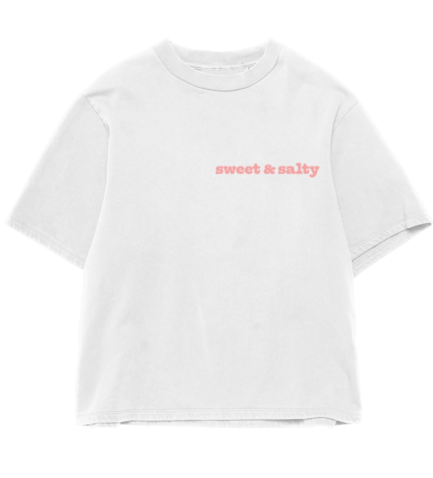 White t-shirt with minimalist pastel peach ‘sweet and salty’ text on white unisex graphic T-shirt