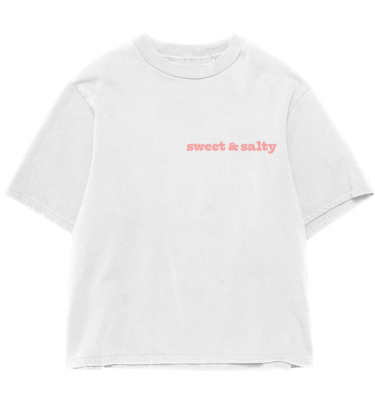 White t-shirt with minimalist pastel peach ‘sweet and salty’ text on white unisex graphic T-shirt